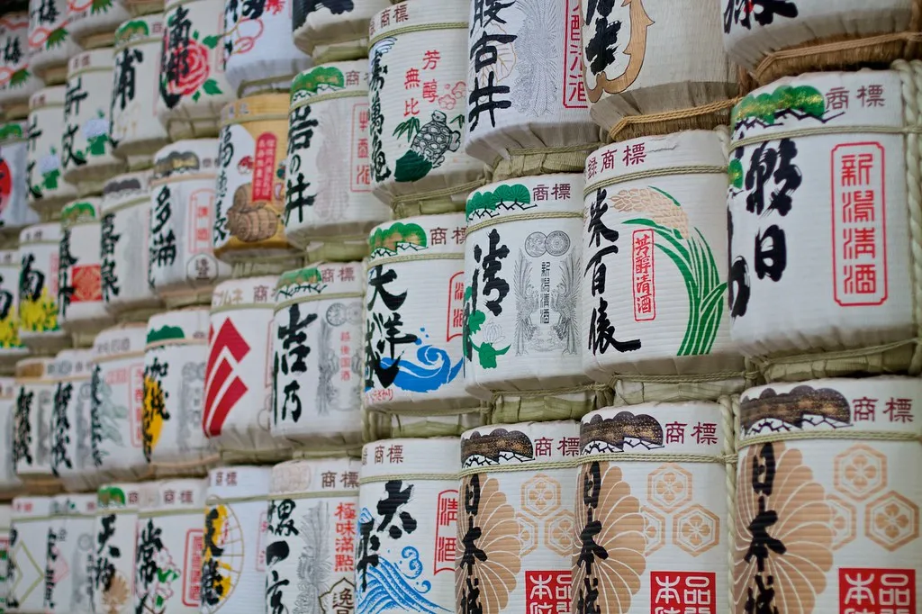 Rows of wrapped sake casks stacked at a Japanese shrine